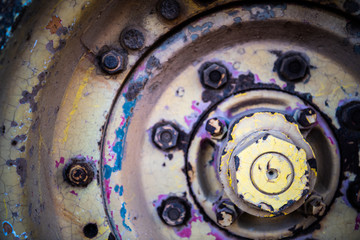 Rusted wheel of a tractor used on a farm
