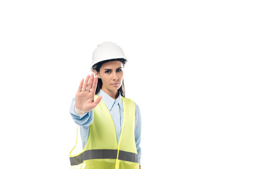 Strict engineer in hardhat showing stop sign isolated on white