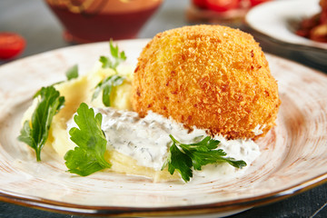 Fried Chicken Kiev made of Meat Fillet Pounded and Rolled around Cold Butter