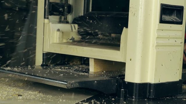 the wood on the jointer machine