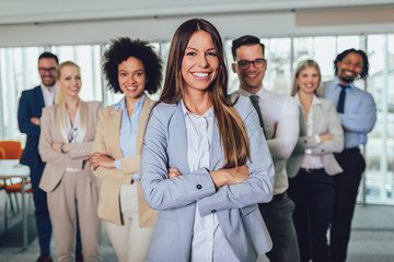 Group of happy business people and company staff in modern office, representig company.Selective focus.