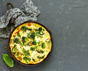 Frittata with vegetables and broccoli. View from above. Selective focus.