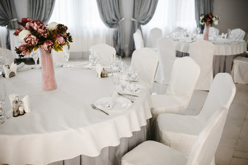 Idea of arranging the holiday table, crystal glasses on white background.