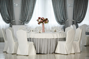 Idea of arranging the holiday table, crystal glasses on white background.