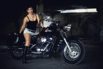 Naklejka na ściany i meble Strong independent , self-sufficient girl with male fascination on chopper motorcycle, international womens day concept