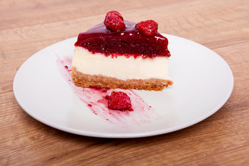 Raspberry Cheesecake on a plate.