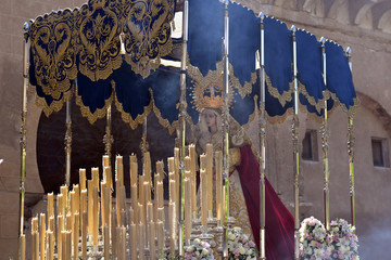 Statue of the Virgin Mary on a gilded platform in procession during Holy Week in Cordoba, Spain