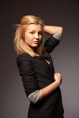 Fototapeta premium Beautiful blond girl posing in the studio