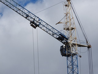 Tower cranes and their parts, construction of a new house.