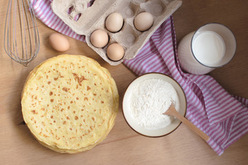 crepes preparation concept with ingredients on tabletop
