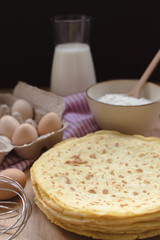crepes preparation concept with ingredients on tabletop