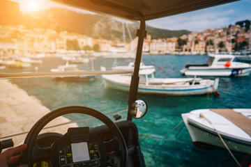 small electric recreational vehicle, bay in the background