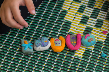 Playing with stones and play dough for children’s activities in preschool or nursery.creative ideas for child development.back to school and happy teachers day concept.