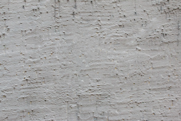 gray concrete wall with bubbles and yellow and green lines, abstract background.