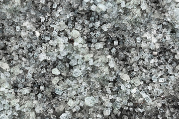 Texture – shattered transparent glass on the asphalt. Shards of ice on the ground.