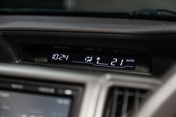 Obraz premium Сlose-up of the car black interior: dashboard with watch, temperature,monitor.