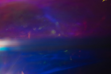 Fototapeta na wymiar Soft defocused purple dark blue background. Outer space concept. Lens flare blur.