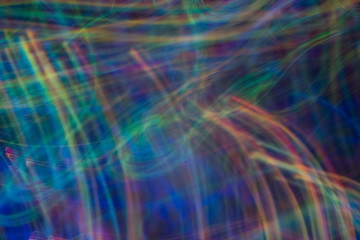 Fototapeta premium Bokeh abstract background with multicolor blue lights in motion. Blur lens flare glow.