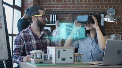 Architect using VR headset for presentation