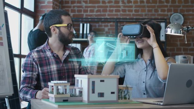 Architect using VR headset for presentation