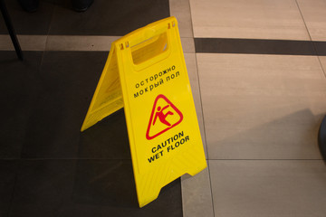 warning yellow sign wet floor