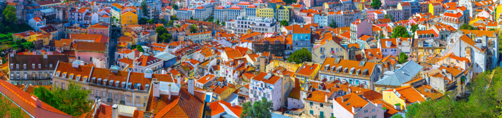 Fototapeta na wymiar Summertime sunshine day cityscape panoramic view of historic old centre in Lisbon, Portugal.