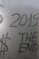 dollar end 2019 inscription on the glass after the rain