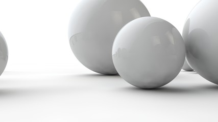 3D illustration of large and small white spheres and many different balls on a white surface. The idea of beauty. Comparative image of the geometry of space. 3D rendering isolated on white background.