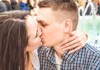 The young married loving couple embraces and kisses. Love and relations. Emotions. Happiness.