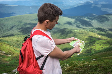 Man traveler outdoor with map route, summer trip