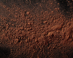 Cocoa powder isolated on black background and texture