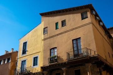 Fototapeta na wymiar Old building facades and balconies. Tarragona, Spain