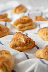 Homemade cottage cheese biscuits on cloth, side view. Selective focus. Closeup.