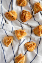 Homemade cottage cheese biscuits on cloth, top view. From above, overhead, flat lay.
