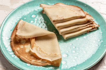 homemade pancakes pile on plate traditional for Russian pancake week. Top view. Flat lay. space for text