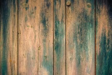 Old faded paint on wooden boards