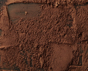 Cocoa powder isolated on black background and texture