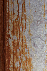 Wall with rust runoff, can be used as a background.