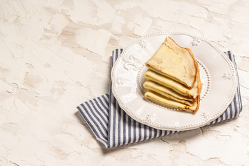 traditional homemade blinis or crepes on plate. Top view. Flat lay. space for text