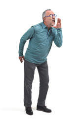 man putting a hand in mouth and is screaming on white background