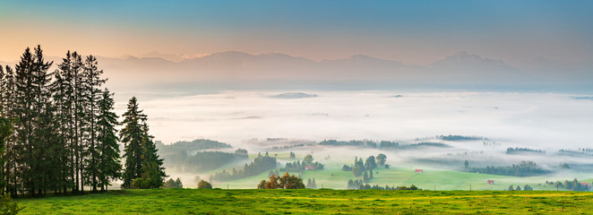 Panoramic View from Mt. Auerberg at Sunrise, Valley full of Fog, the Alps behind, Bavaria, Germany