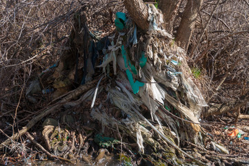 Plastic and foam garbage floating on the surface of the river