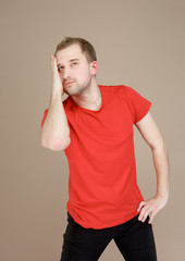 emotional man in a red t-shirt