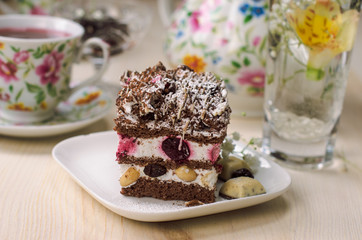 Still life on the table. Sweet cake and a hot drink .
