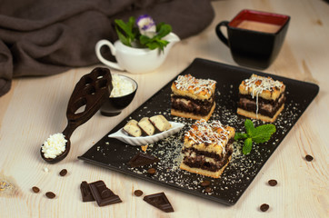 Still life on the table. Sweet cake and a hot drink .