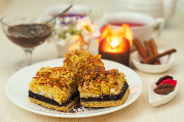 Still life on the table. Sweet cake and a hot drink .