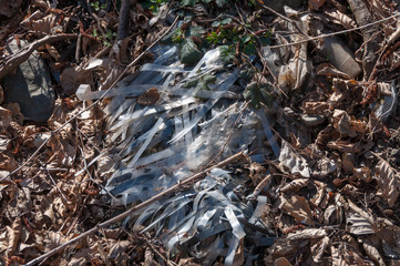 Plastic and foam garbage floating on the surface of the river