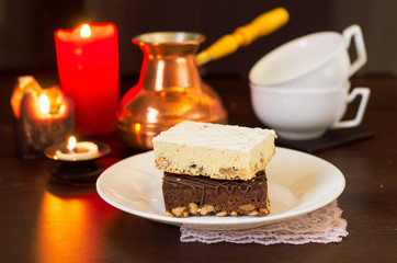 Still life on the table. Sweet cake and a hot drink .