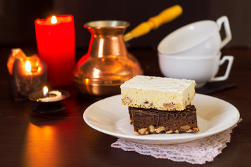 Still life on the table. Sweet cake and a hot drink .