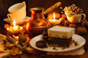 Still life on the table. Sweet cake and a hot drink .